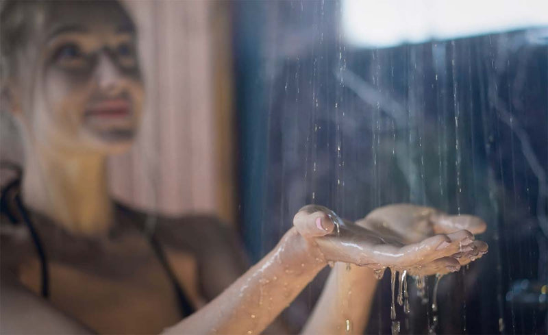 woman contemplating whether skincare before or after shower